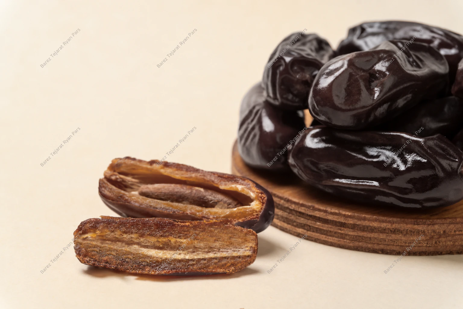 Close-up of Iranian dates and a halved date with its pit
